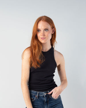 woman with red hair wearing the 90s tank in black