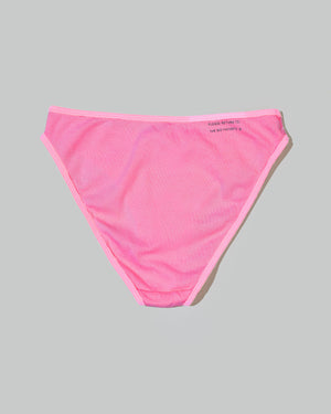 a bikini brief in hot pink laid on the floor