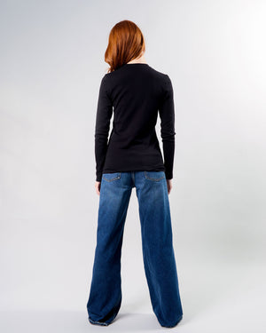 woman with red hair wearing the big favorite's micro vneck tee, back view