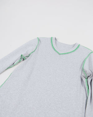 lay down of the heather grey micro vneck long sleeve tee reversed with pop color interior stitching in green