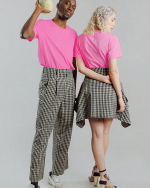a man and woman wearing the naturally dyed better barbie hot pink t-shirt