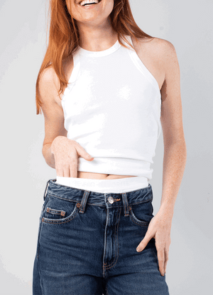 a gif of a woman with red hair wearing the 90s tank in white