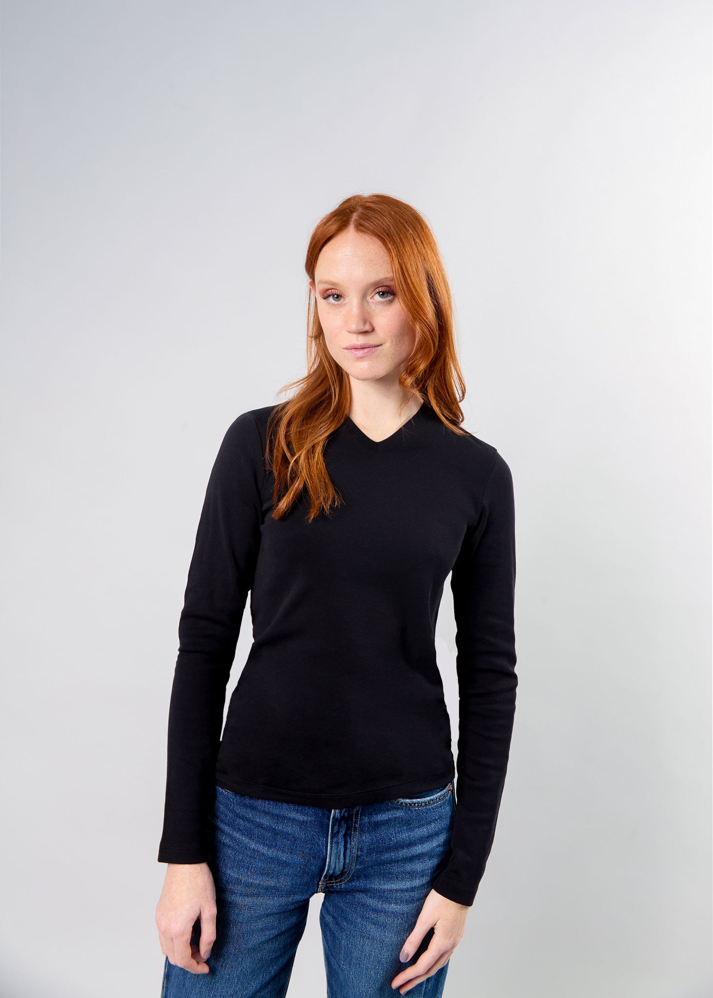 woman with red hair wearing the big favorite's micro vneck tee
