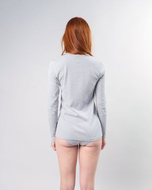woman with red hair wearing the big favorite's micro vneck tee in heather grey, back view