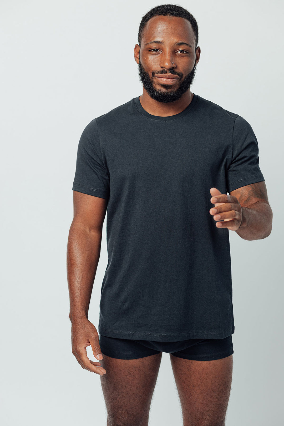 man wearing a navy crewneck