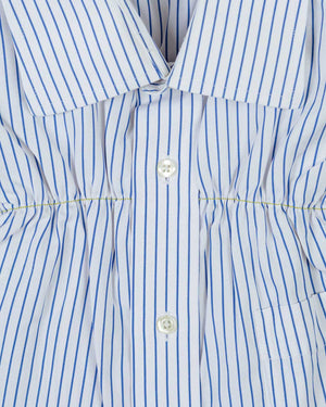 blue and white striped shirt with yellow topstitching ruching detail