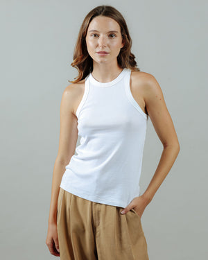 woman wearing the 90s tank in white from the front untucked